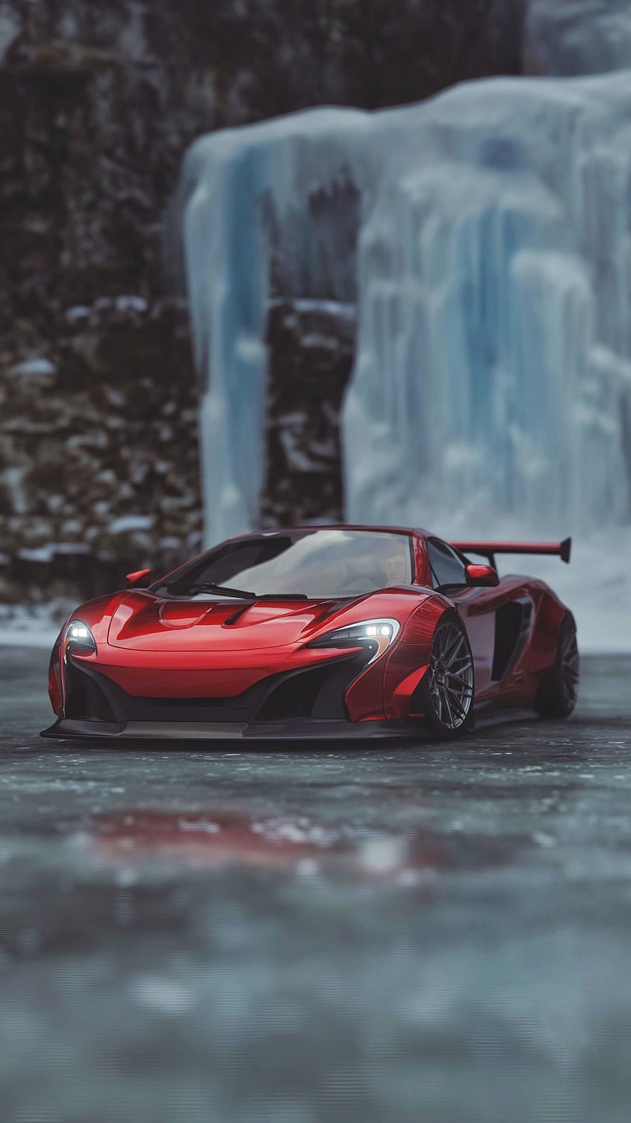 Red McLaren 650S Super Series parked on wet pavement before a frozen waterfall in a winter landscape HD phone wallpaper