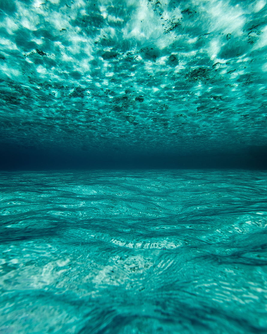 Underwater View of Turquoise Ocean Surface in the Maldives HD phone wallpaper