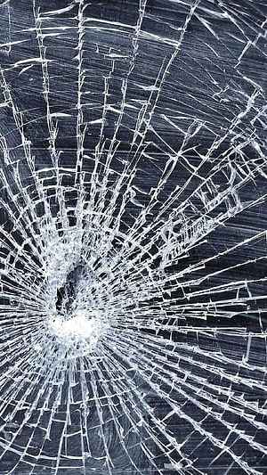 Shattered Glass Texture with Radiating Fracture Lines on Dark Background HD phone wallpaper