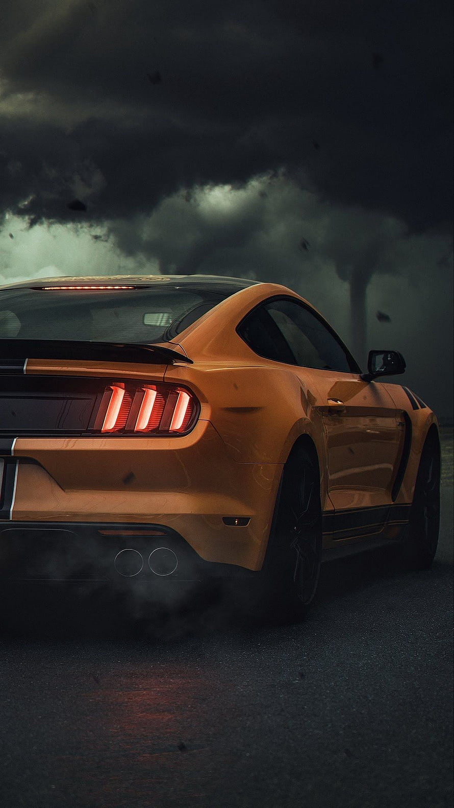 Orange Ford Mustang GT Rear View in Stormy Weather with Smoke and Dark Clouds HD phone wallpaper