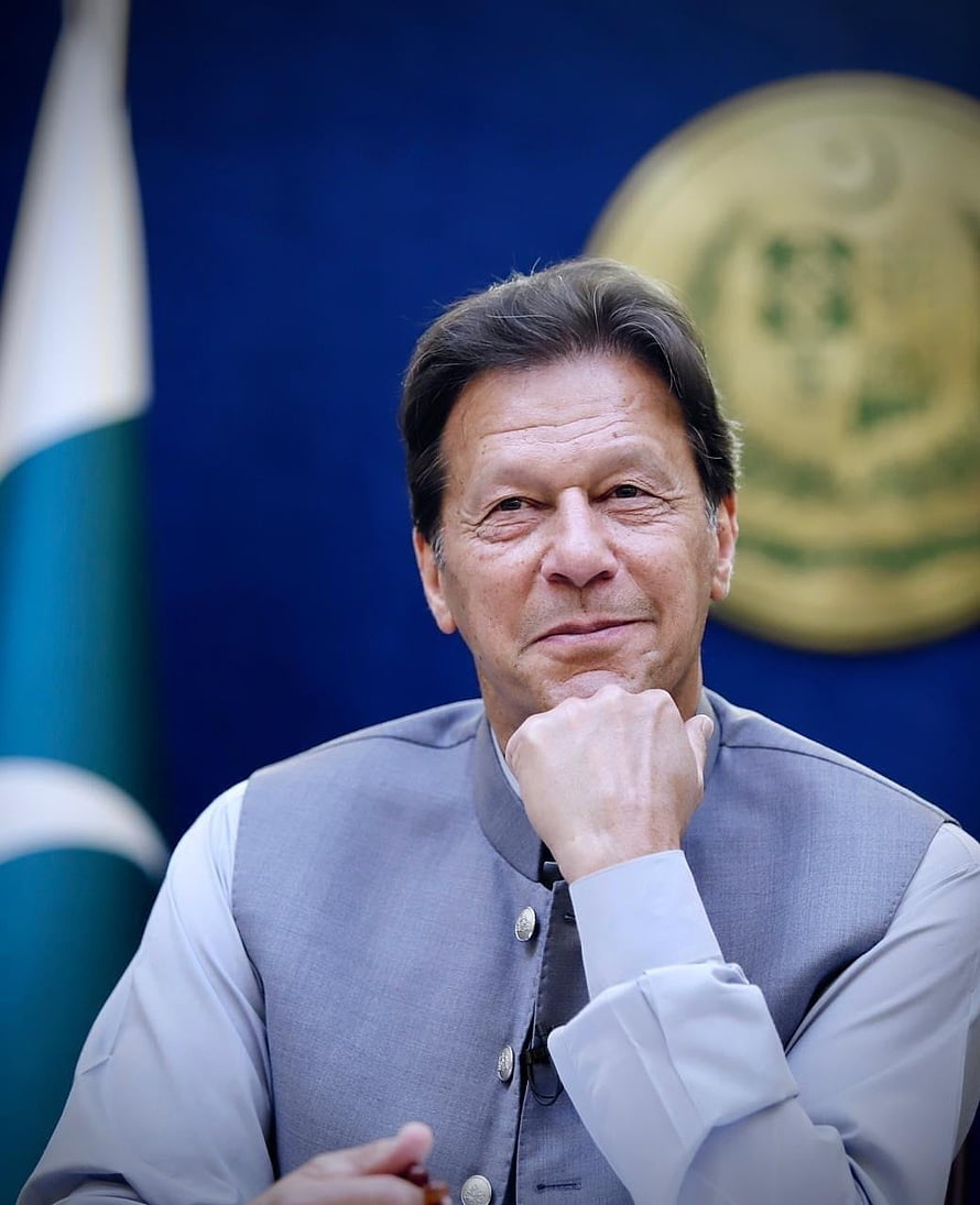 Imran Khan Portrait in Grey Waistcoat with Pakistan Flag and Emblem Background HD phone wallpaper