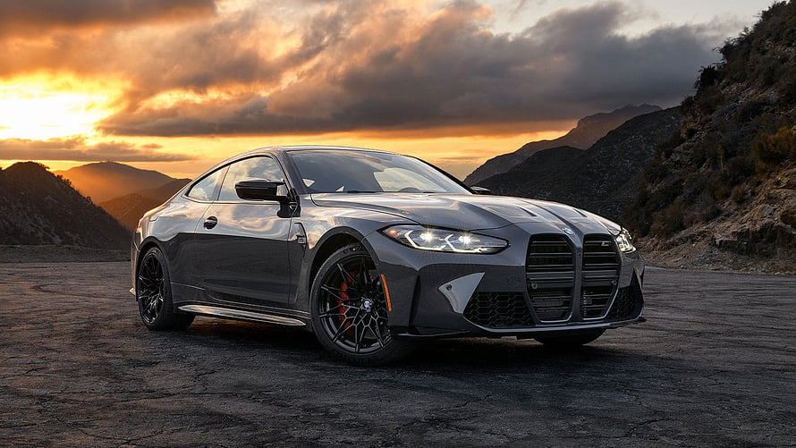 BMW M4 Competition Coupe in Dark Grey Parked on Mountain Road at Sunset HD wallpaper
