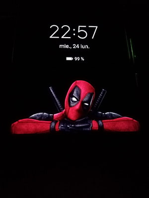 Deadpool Peeking Over Edge With Crossed Swords On Black Background HD phone wallpaper