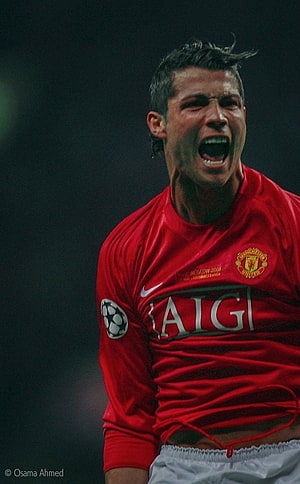 Cristiano Ronaldo in Manchester United Red Kit Celebrating on the Pitch HD phone wallpaper