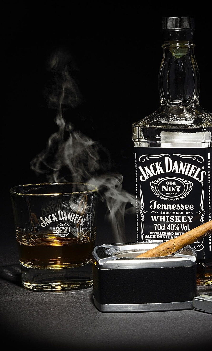 Jack Daniel's Old No. 7 Whiskey Bottle, Glass, and Cigar with Smoke on Black Background HD phone wallpaper