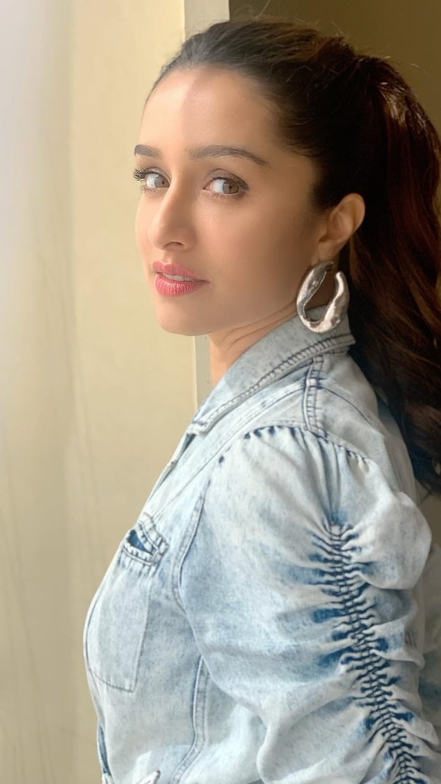 Shraddha Kapoor in a light blue denim jacket with statement silver hoop earrings HD phone wallpaper