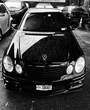Black Mercedes-Benz W211 E-Class Front View with Rain Droplets on Wet Asphalt HD phone wallpaper