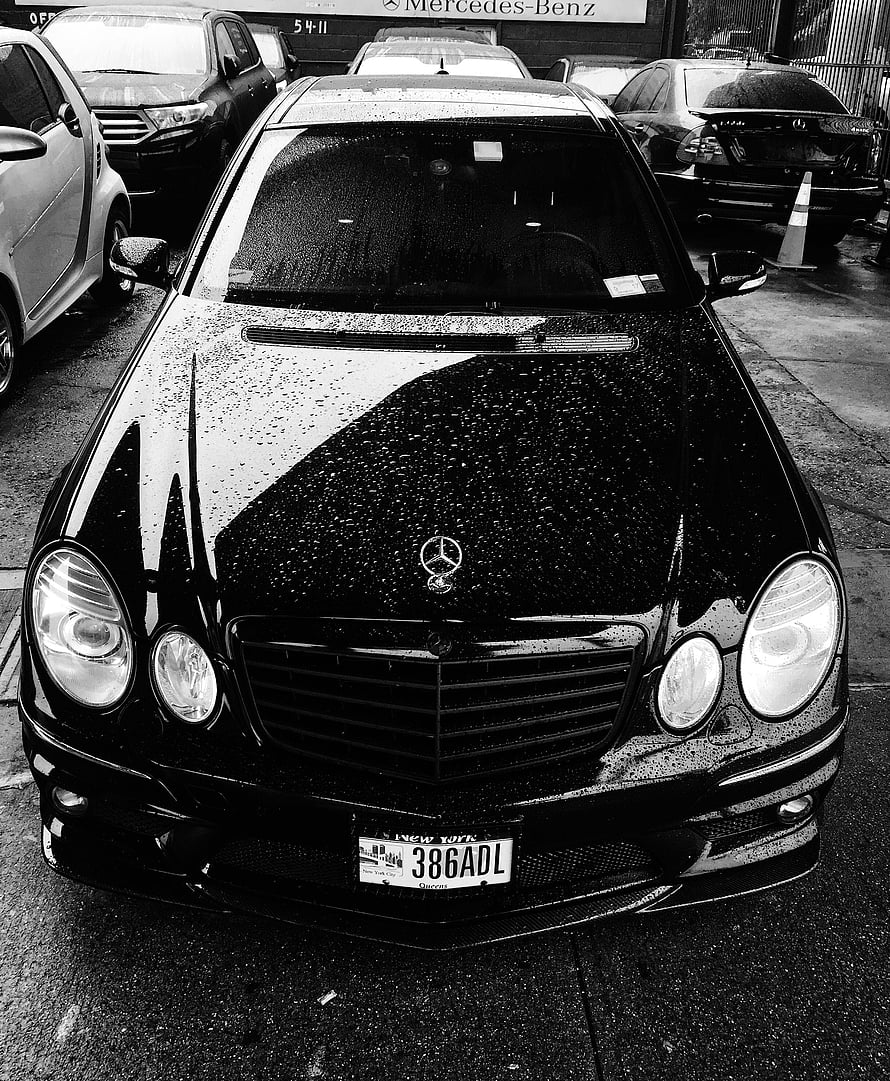 Black Mercedes-Benz W211 E-Class Front View with Rain Droplets on Wet Asphalt HD phone wallpaper