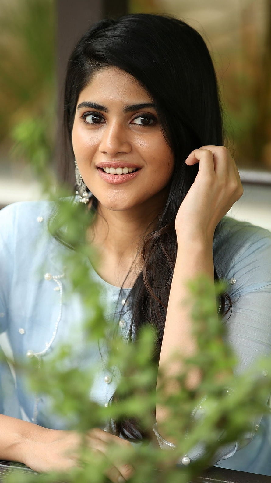 Megha Akash Portrait in Light Blue Blouse with Green Foliage HD phone wallpaper