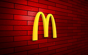 McDonald's Golden Arches 3D Logo on Red Brick Wall HD wallpaper
