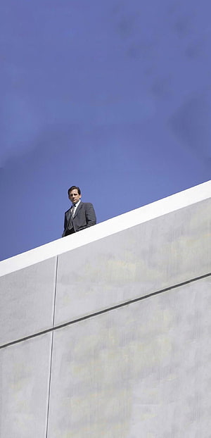 Michael Scott from The Office Standing on a Concrete Wall Under a Clear Blue Sky HD phone wallpaper