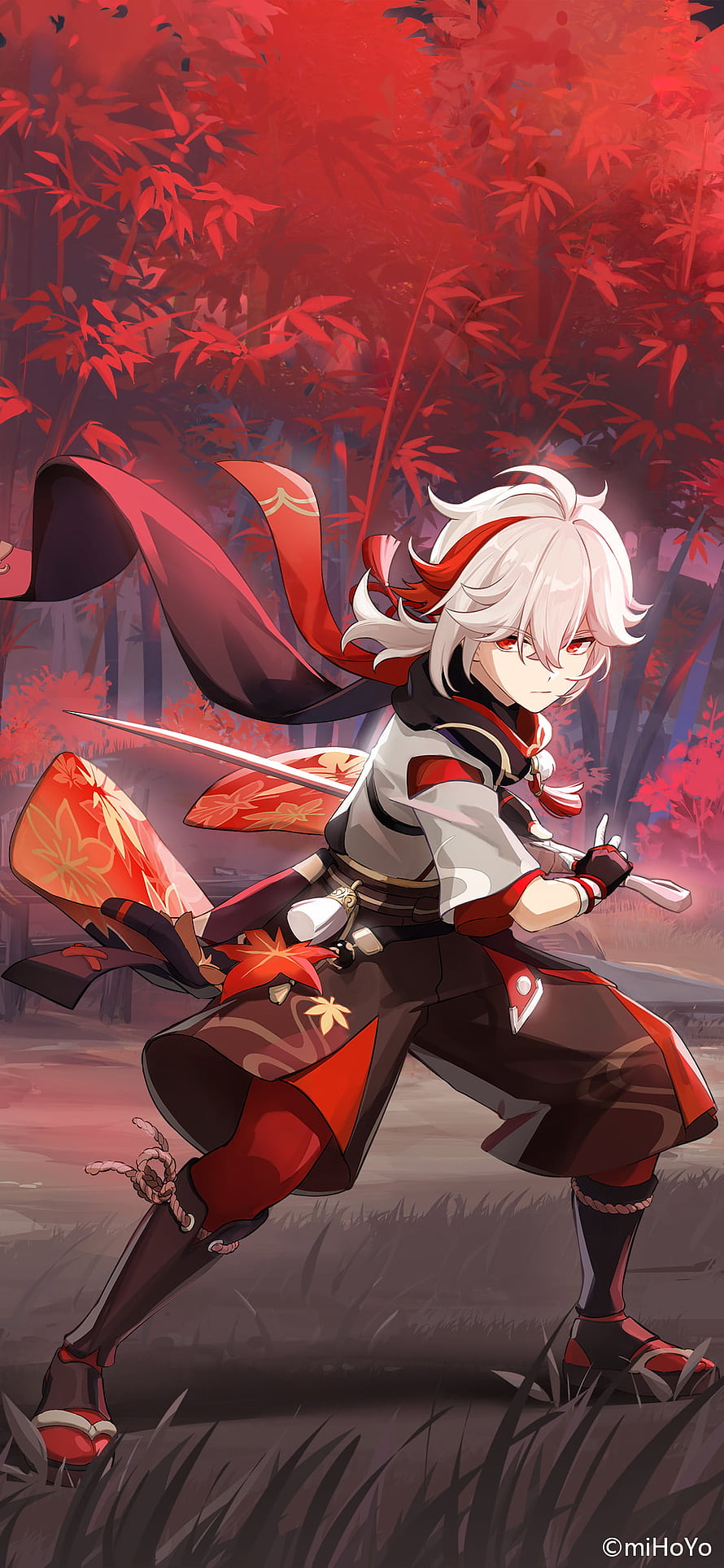 Kazuha from Genshin Impact in a dynamic combat stance within a vibrant red maple forest HD phone wallpaper