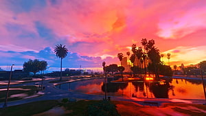 Vibrant Sunset Over Palm Trees and Reflective Pool in a Stylized Urban Park HD wallpaper