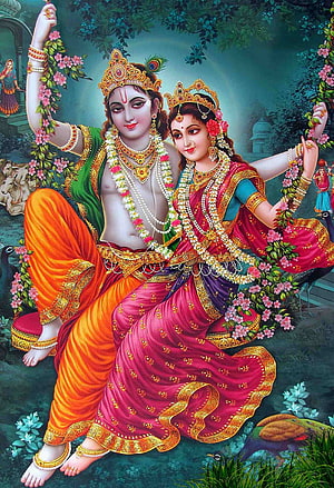 Radha Krishna on a Flower-Adorned Swing in a Lush Garden HD phone wallpaper