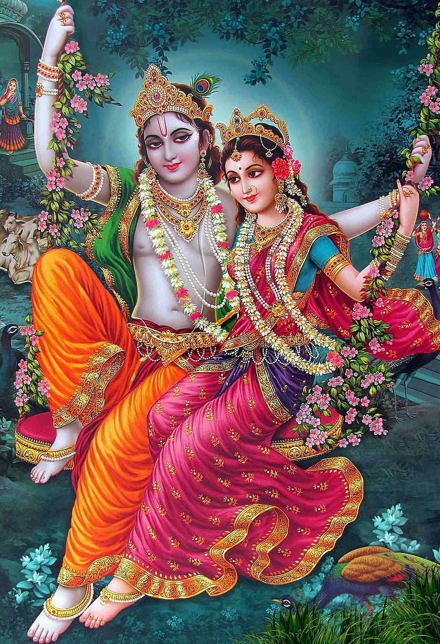 Radha Krishna on a Flower-Adorned Swing in a Lush Garden HD phone wallpaper