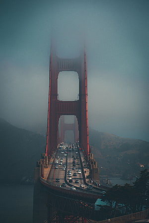 Golden Gate Bridge Tower Rising Through Thick Fog With Busy Traffic Flow HD phone wallpaper