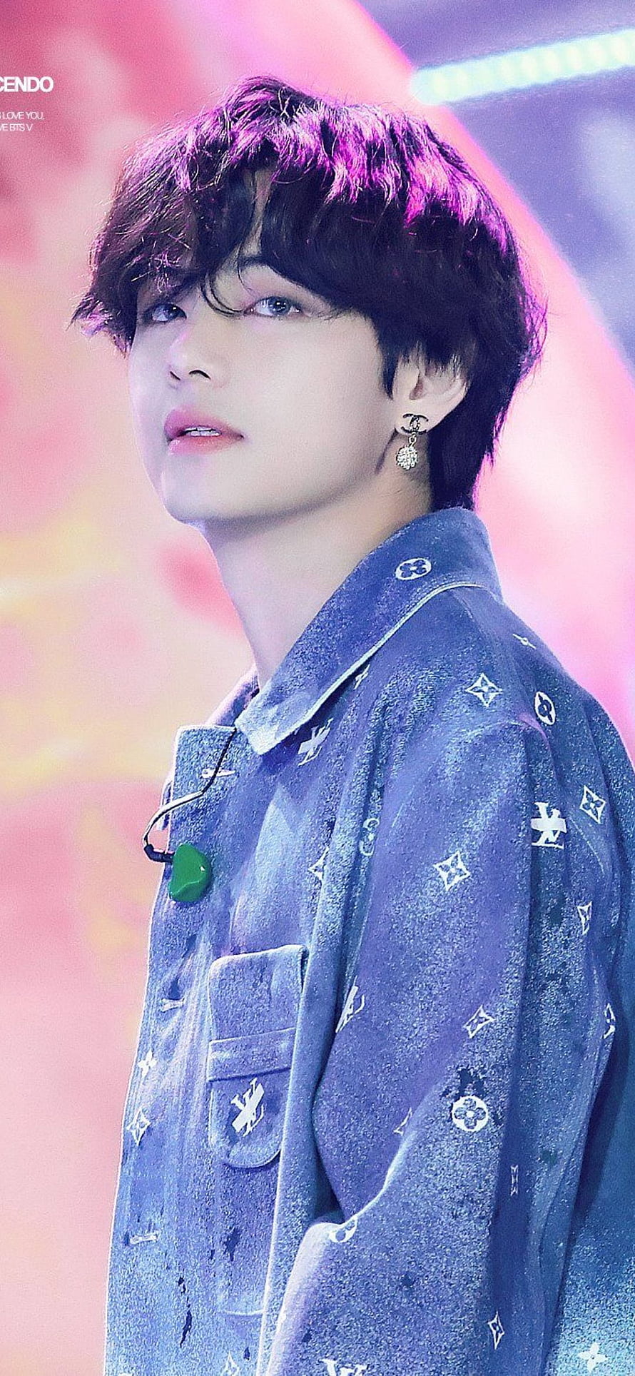 V from BTS in a blue patterned jacket with purple stage lighting HD phone wallpaper