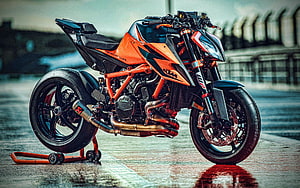 KTM 1290 Super Duke R Orange Naked Motorcycle on Wet Raceway Track HD wallpaper