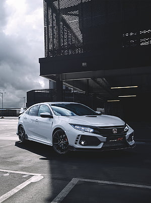 White Honda Civic Type R parked in a modern parking structure under a dramatic cloudy sky HD phone wallpaper