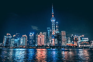 Shanghai Bund Night Skyline with Oriental Pearl Tower and Huangpu River Reflections HD wallpaper