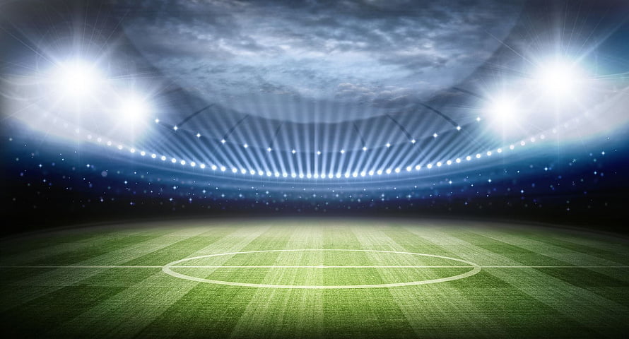 Empty Soccer Stadium Pitch Under Bright Floodlights at Night HD wallpaper