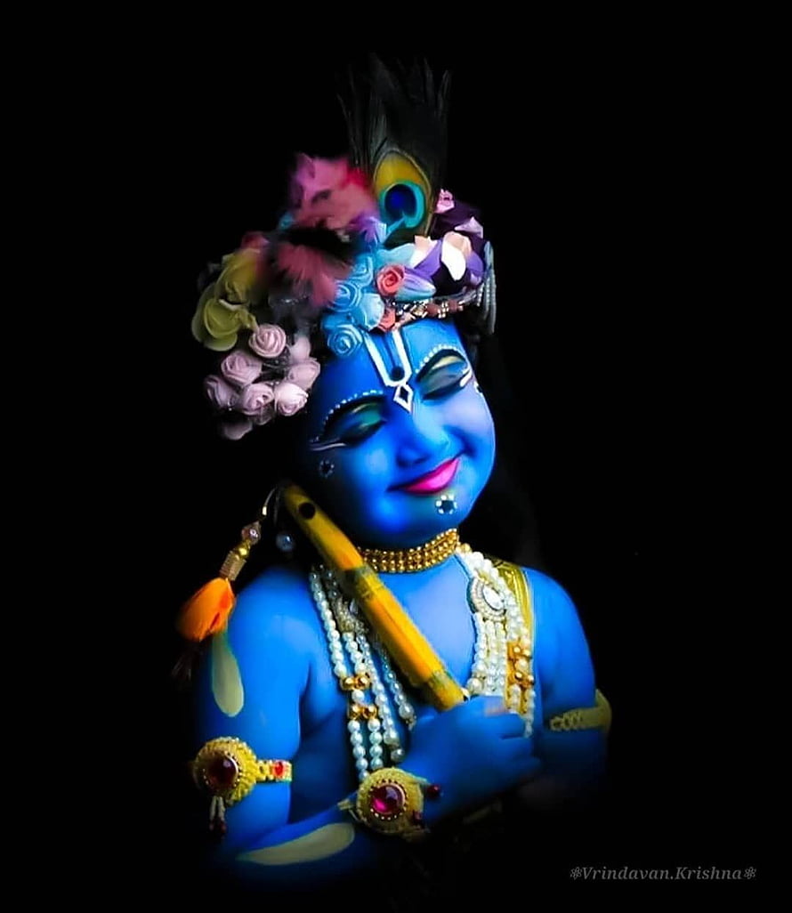 Blue Krishna Statue Playing Flute with Peacock Feather Crown and Floral Garland HD phone wallpaper