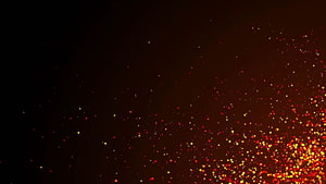 Glowing Fire Sparks and Embers Drifting Across a Dark Background HD wallpaper