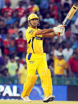 MS Dhoni in Chennai Super Kings yellow kit mid-swing with Spartan bat during IPL match HD phone wallpaper