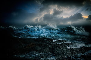 Dark Stormy Ocean Waves Crashing Against Rocky Coastline Under Dramatic Clouds HD wallpaper