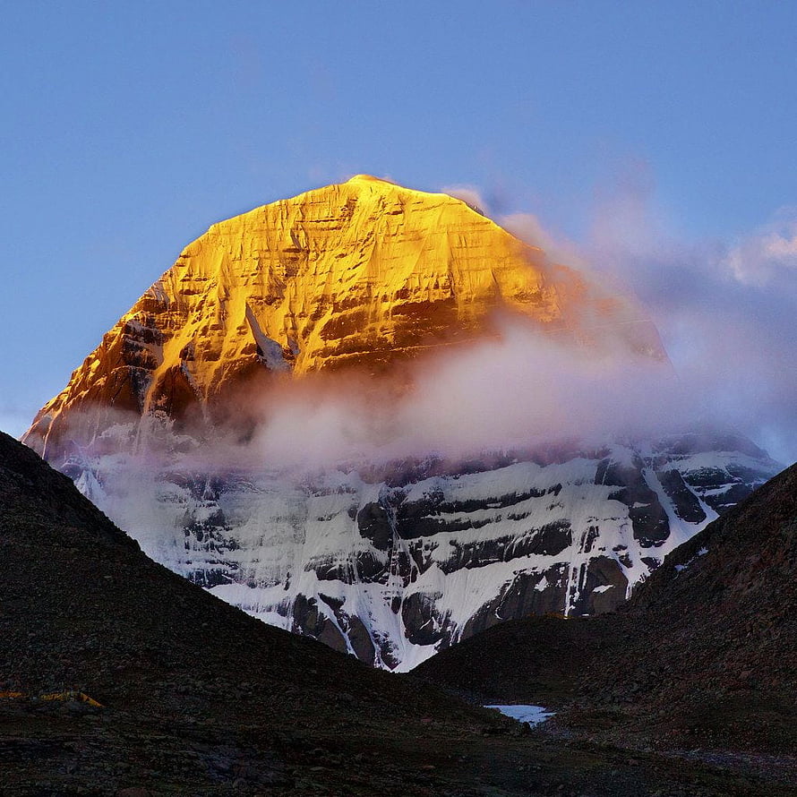 Golden Sunrise Illuminating The Majestic Peak Of Mount Kailash Amidst Swirling Clouds HD phone wallpaper