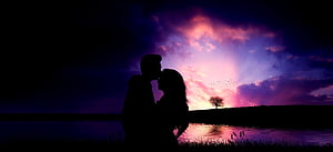 Romantic Couple Silhouette Kissing at Sunset by a Lake with Vibrant Purple Sky HD wallpaper