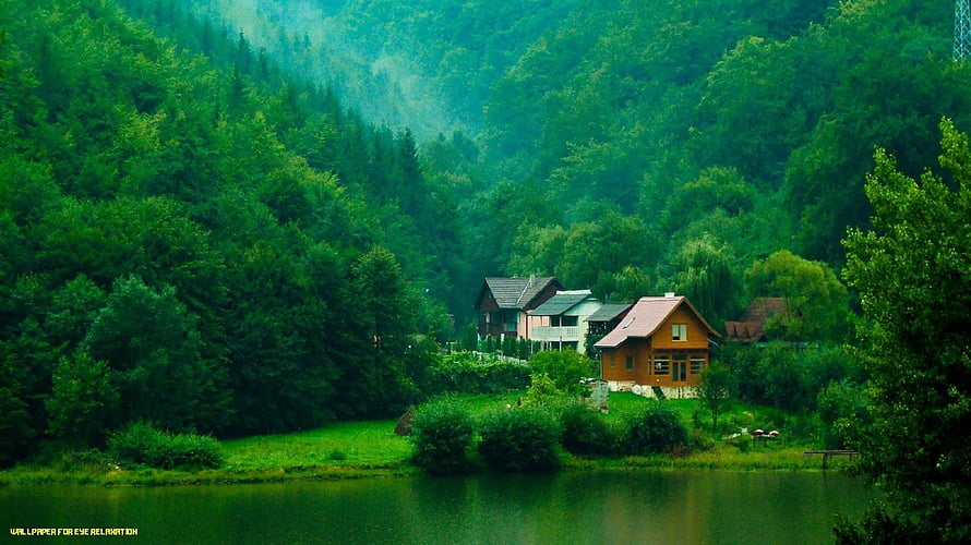 Serene Lakeside Village Surrounded by Lush Green Forest and Mountains HD wallpaper