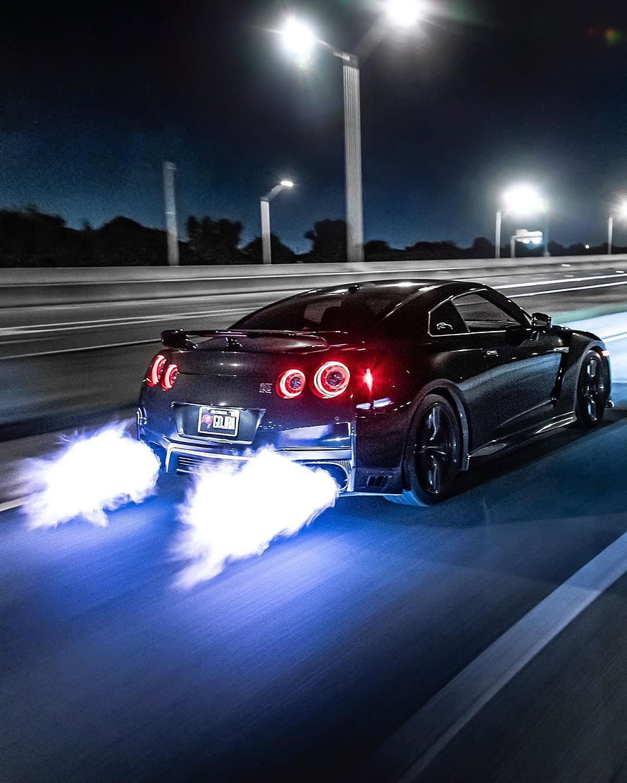 Black Nissan GT-R R35 Launching With Blue Underglow Flames At Night HD phone wallpaper