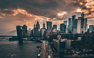 Dramatic Sunset Over Manhattan Skyline With Brooklyn Bridge And East River HD wallpaper