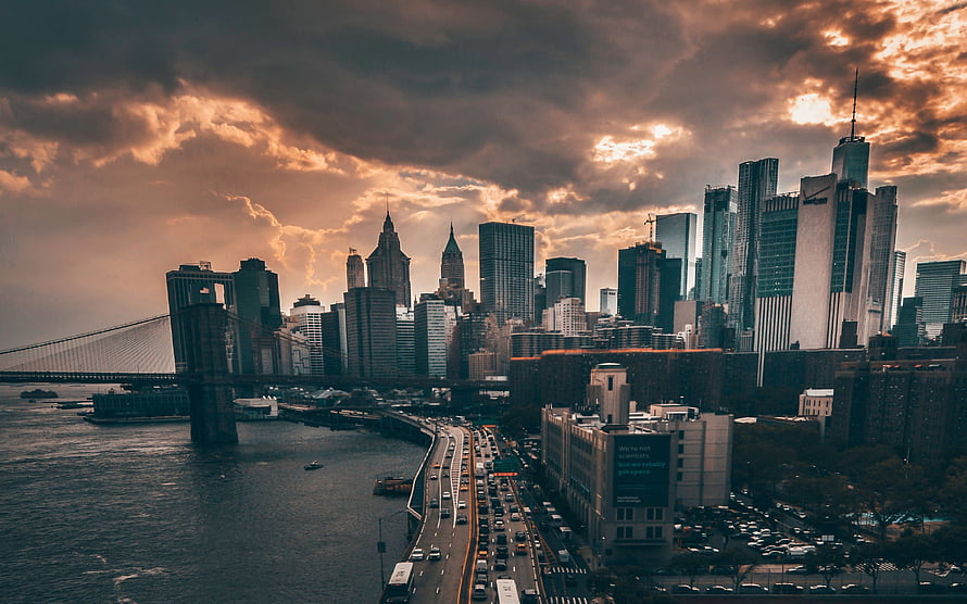 Dramatic Sunset Over Manhattan Skyline With Brooklyn Bridge And East River HD wallpaper