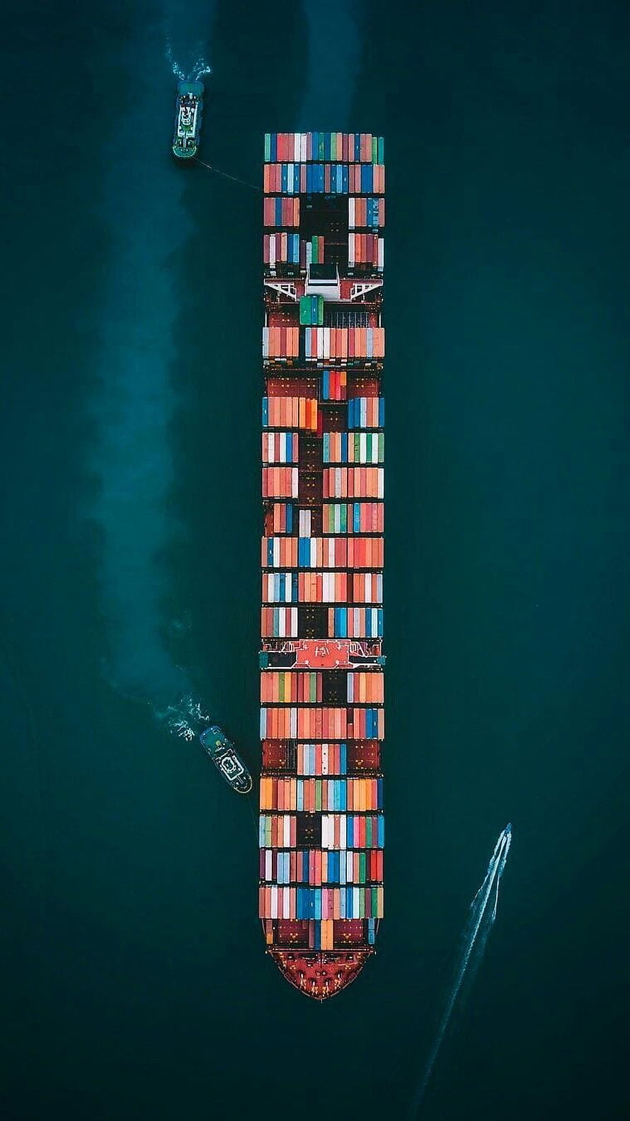 Aerial View of Massive Cargo Ship Loaded with Colorful Shipping Containers on Deep Blue Ocean HD phone wallpaper