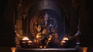 Golden Ganesha Statue in Ancient Temple with Oil Lamps and Intricate Carvings HD wallpaper