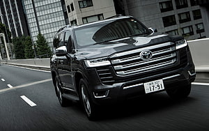 Black Toyota Land Cruiser 300 Series Driving on City Highway HD wallpaper