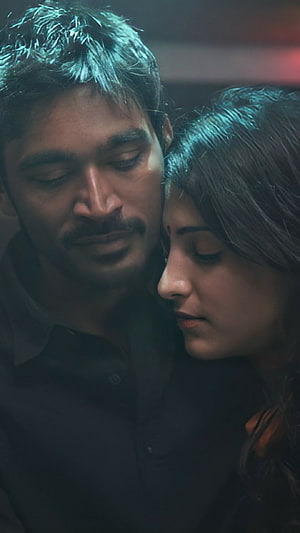 Dhanush and Actress in Intimate Romantic Embrace with Moody Cinematic Lighting HD phone wallpaper