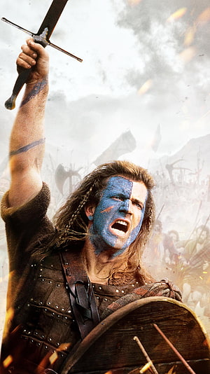 Braveheart Warrior With Blue Face Paint Raising Sword in Epic Battle Scene HD phone wallpaper