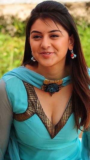 Anushka Shetty in a stunning turquoise traditional outfit with gold embroidery and floral brooch HD phone wallpaper