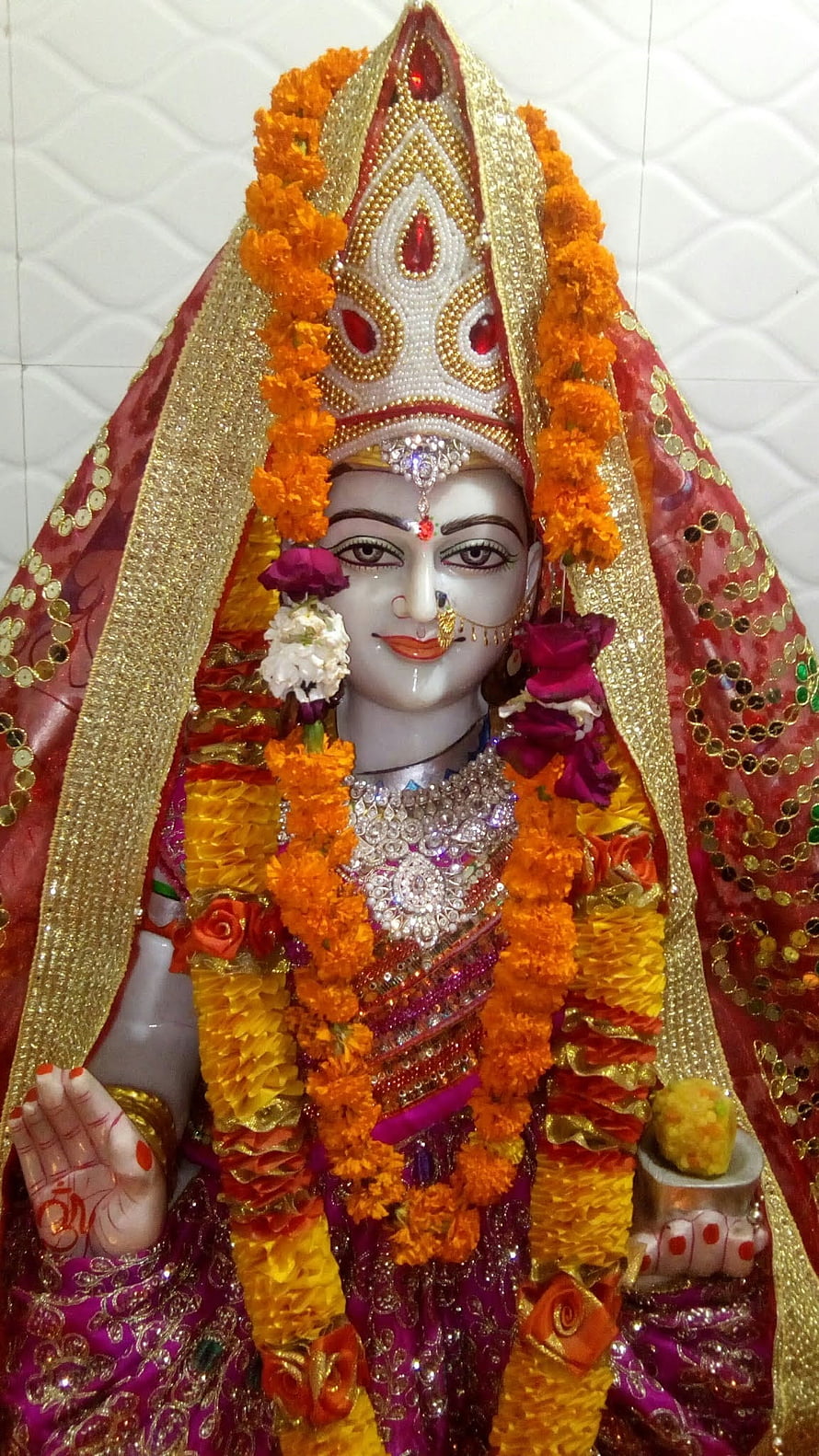 Santoshi Mata Deity Adorned With Marigold Garlands And Ornate Temple Attire HD phone wallpaper