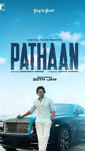 Pathaan Movie Poster Featuring Shah Rukh Khan Leaning on a Luxury Car HD phone wallpaper