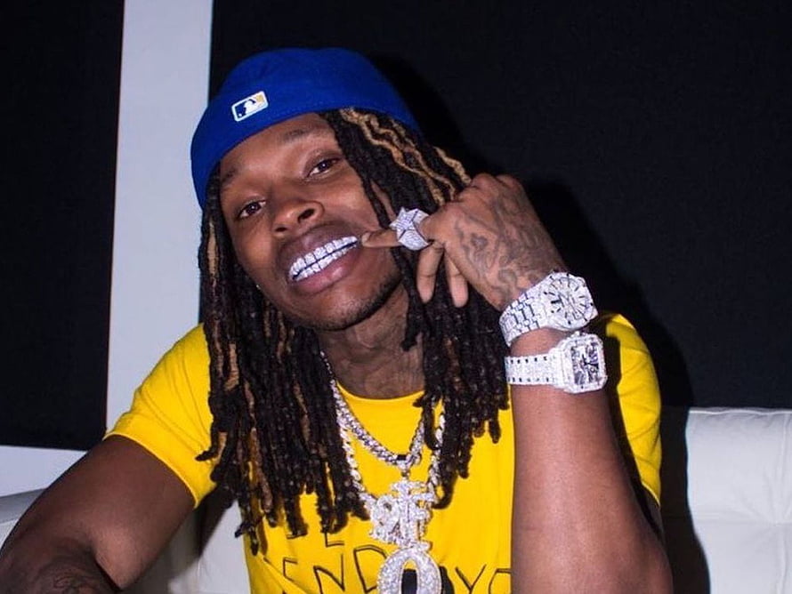 King Von Portrait in Yellow Tee and Blue Cap with Diamond Jewelry HD wallpaper