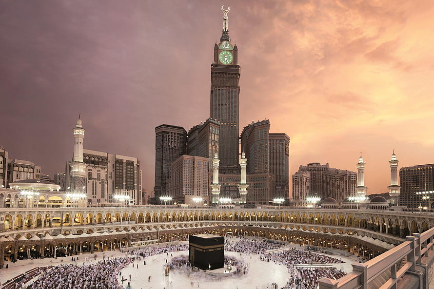 Majestic View of the Kaaba and Abraj Al Bait Clock Tower at Sunset HD wallpaper