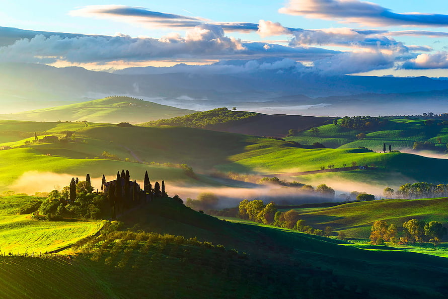Sunlit Tuscany Hills with Rolling Green Fields, Morning Mist, and a Historic Villa at Dawn HD wallpaper