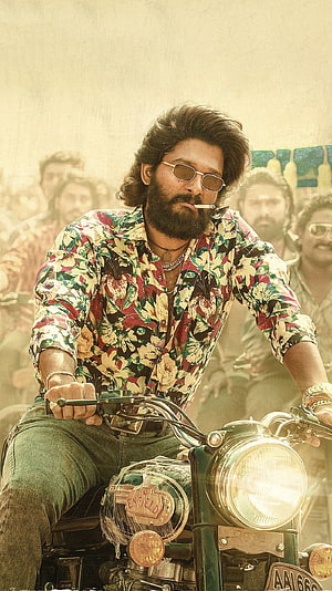 Allu Arjun as Pushpa Riding a Royal Enfield Motorcycle in a Vibrant Floral Shirt HD phone wallpaper