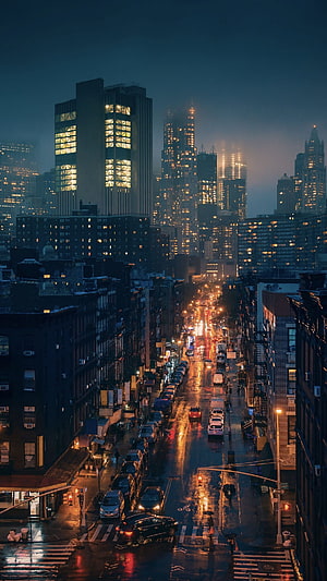 Moody Rainy Night Cityscape with Glowing Streetlights and Wet Asphalt Reflections HD phone wallpaper