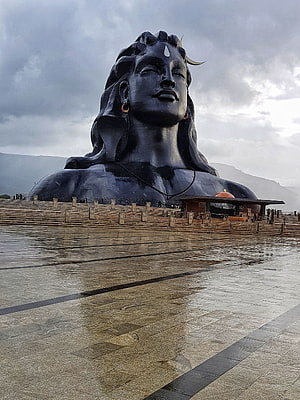 Adiyogi Shiva Statue at Isha Yoga Center with Reflective Plaza and Overcast Sky HD phone wallpaper