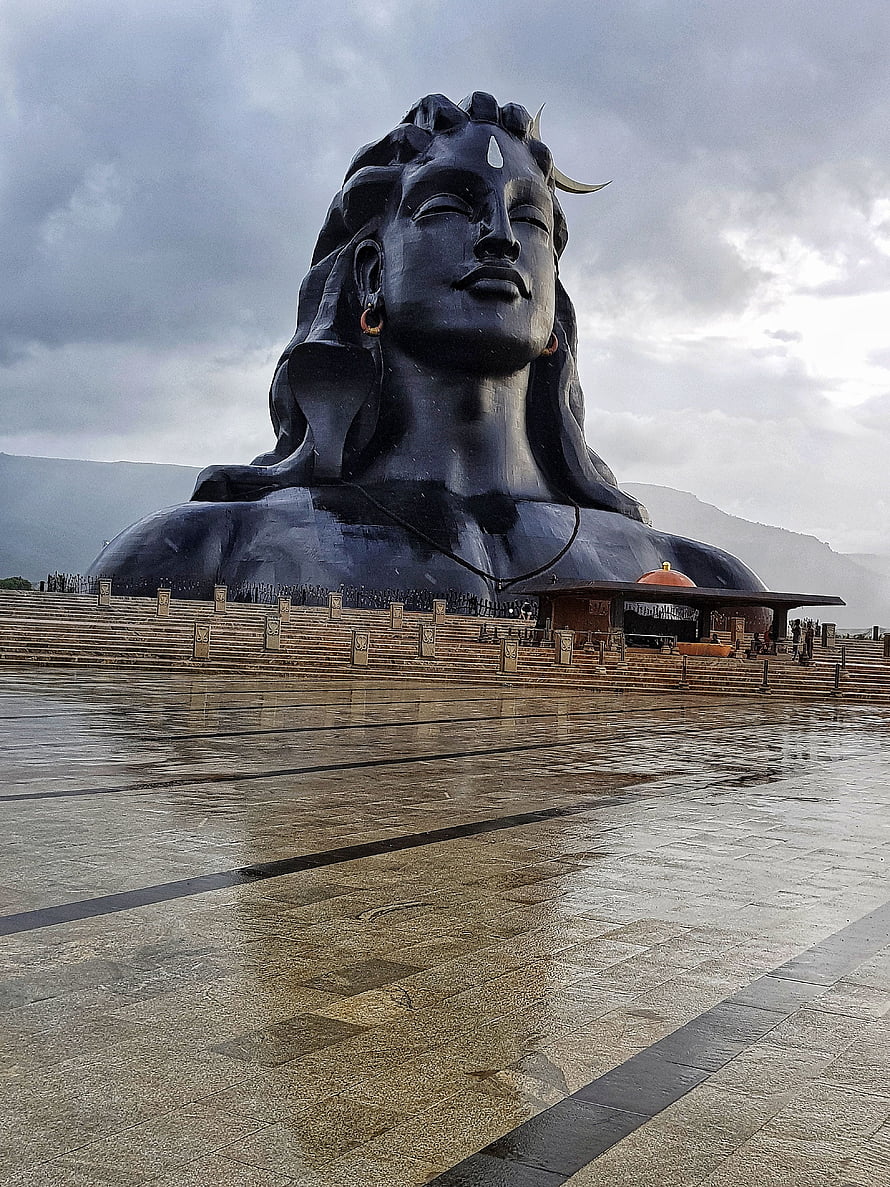Adiyogi Shiva Statue at Isha Yoga Center with Reflective Plaza and Overcast Sky HD phone wallpaper